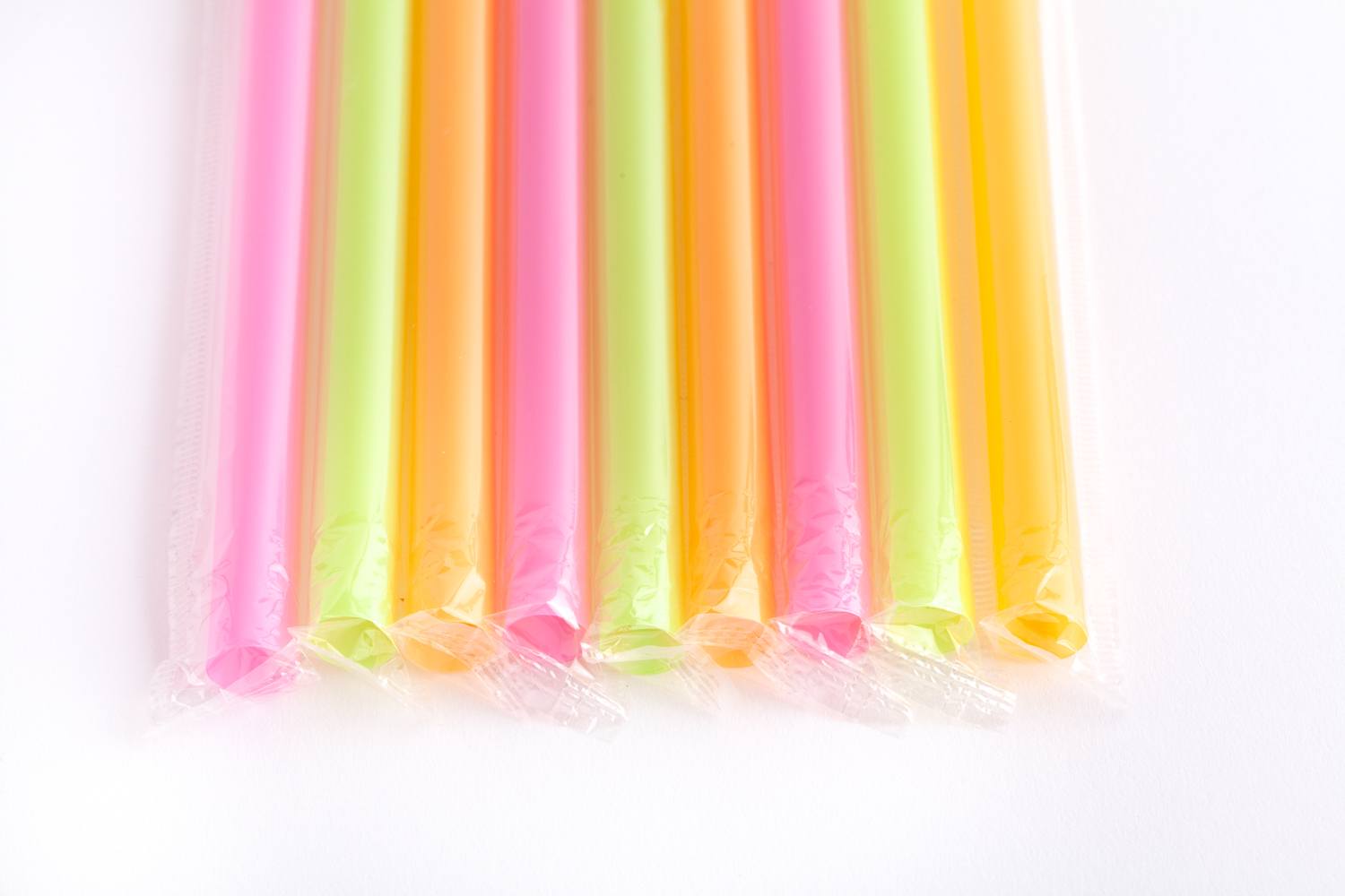 row of wrapped multicoloured plastic straws