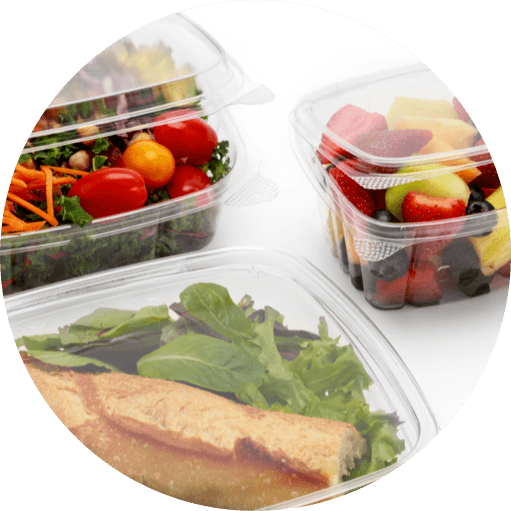 3 clear food containers with sandwich, salad, and fruit salad respectively