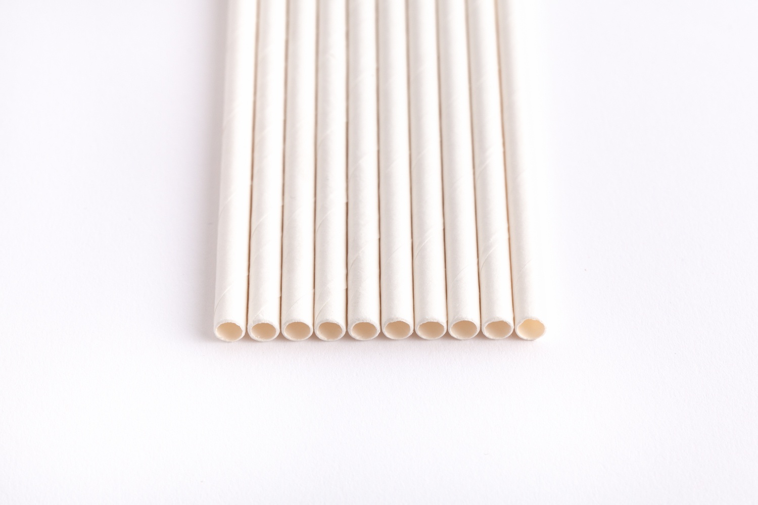 white paper straws lined up in a row